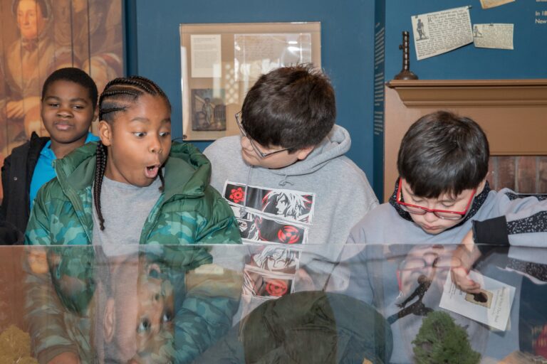 Three Children Looking at a Diorama