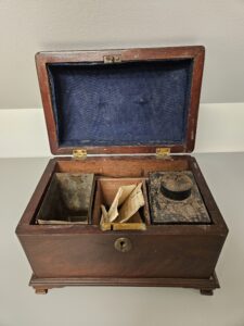 Open 18th-century Mahogany Tea Caddy showing toleware canisters.